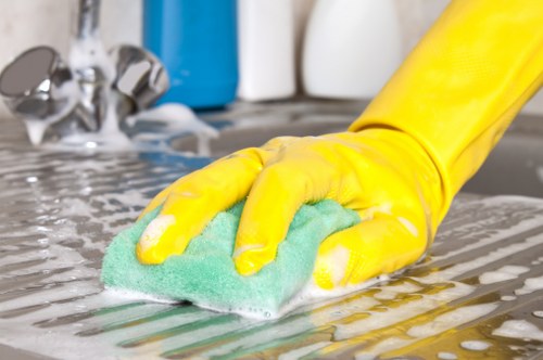 Professional office cleaning team sanitizing workplace surfaces